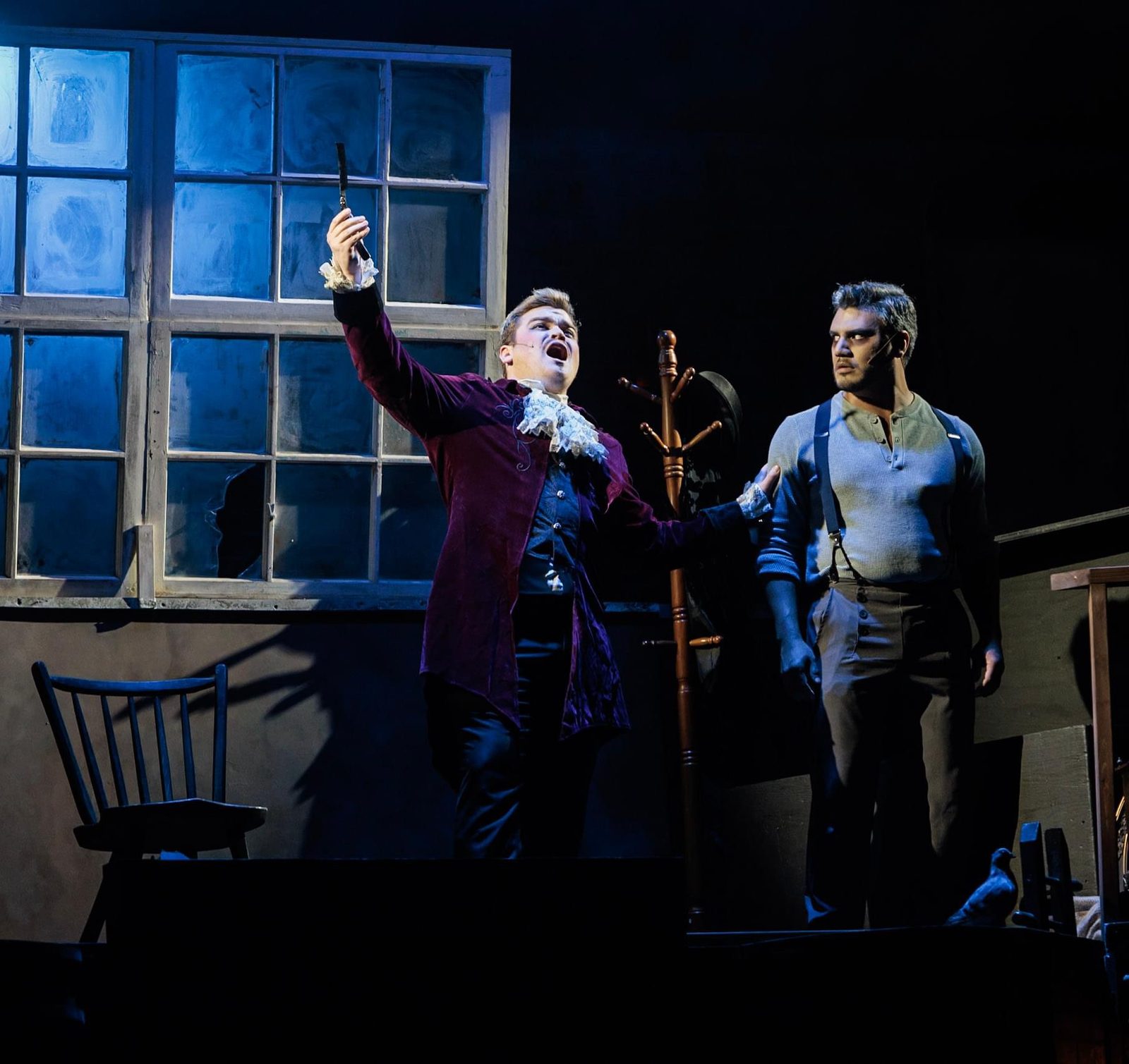 Jackson as Pirelli in Sweeney Todd, arm raised, in a purple velvet coat