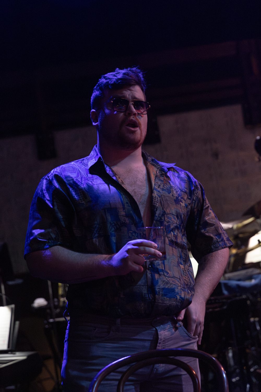 Jackson on stage in The Tin Angel, in sunglasses and an open patterned shirt