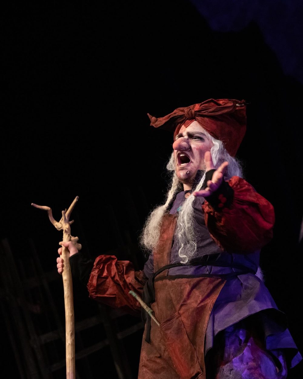 Jackson as the Witch in Hänsel und Gretel, in a red headscarf and grey wig